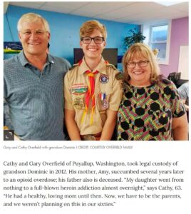 A photo of a boy scout and his family.