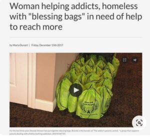 Woman helping addicts homeless with blessing bags in need to help more.